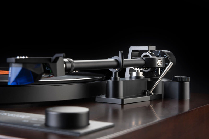 Dual CS 618Q Turntable in a high gloss walnut side view, tonearm close-up.