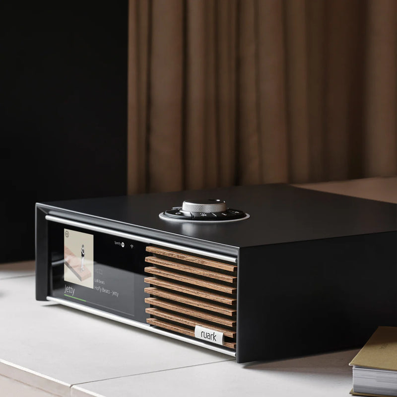 Close up view of Ruark R610 in Satin Charcoal lacquer cabinet with Walnut slat trim