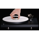 Record Puck PRO - Stabilize your records   Reduces unwanted resonances & improves playback of warped records. The label is protected by the felt pad on the underside.